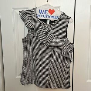 Black and white herringbone top with cross ruffle. Size S